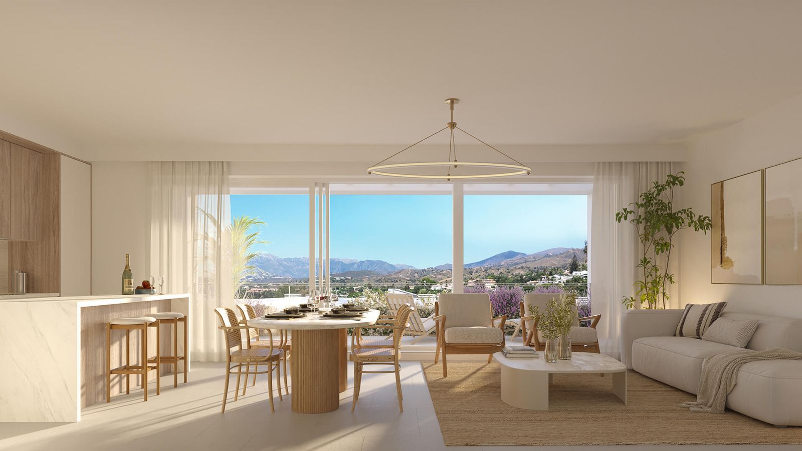 Espace de vie et de salle à manger moderne et lumineux avec vue panoramique sur les montagnes et la côte de Marbella.